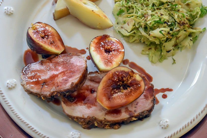 Pork Tenderloin Recipe: Finished dish served with roasted potatoes and shaved brussel sprouts