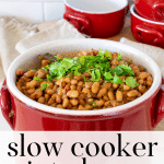 Red crockery filled with crockpot pinto beans.