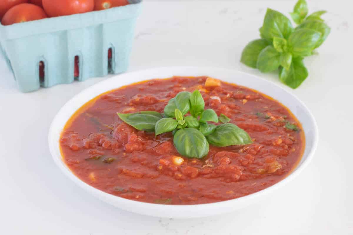 Marinara sauce in a white bowl.