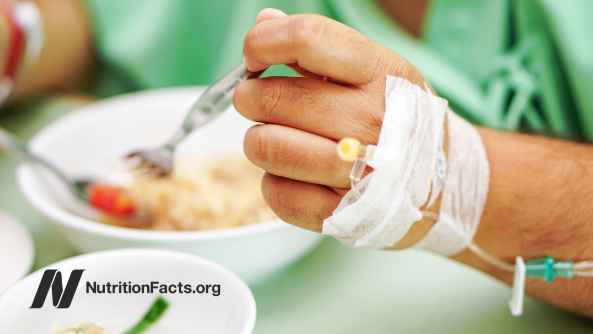 Hospital patient eating hospital food in bed