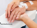 Holding hand of hospital patient