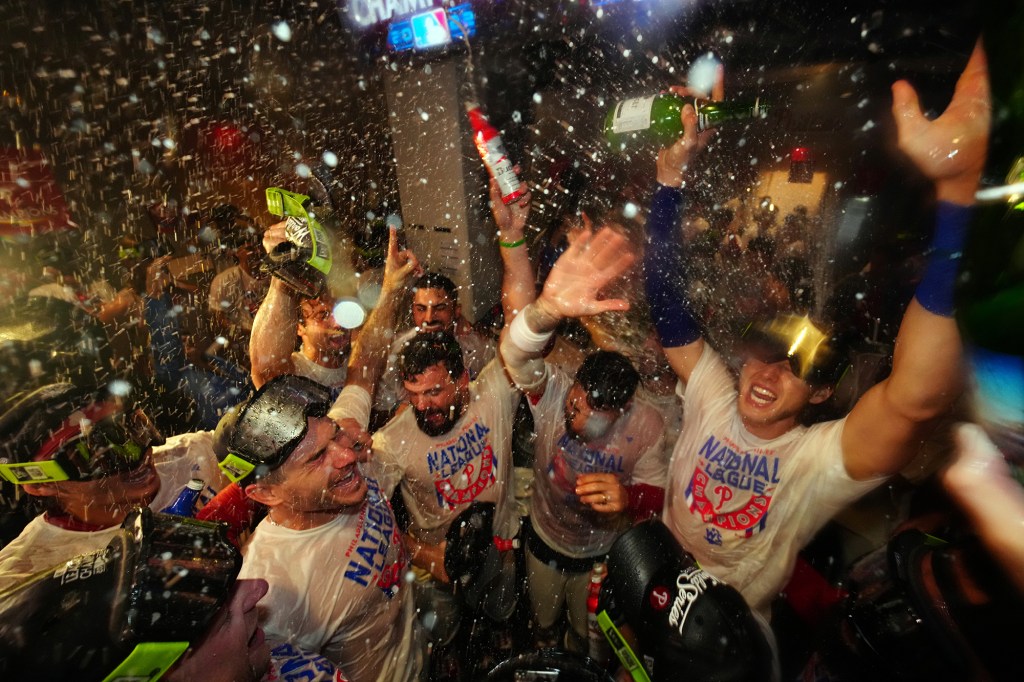 The 2022 Philadelphia Phillies celebrate after winning the NLCS to advance to the World Series.