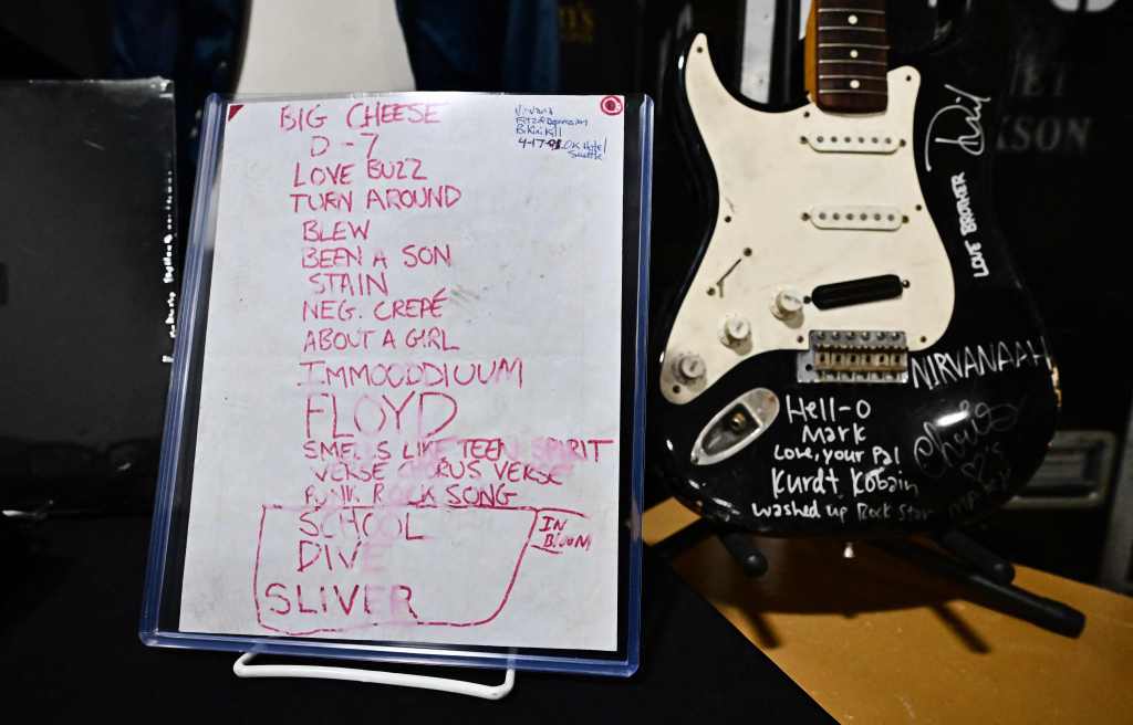 Nirvana's set list from the band's debut performance of their breakthrough hit "Smells Like Teen Spirit," left, sold for just under $51,000. 