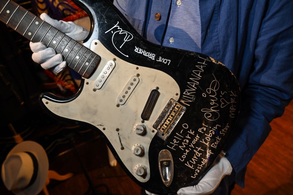 Kurt Cobain's smashed "Nevermind"-era black Fender Stratocaster electric guitar signed by all three members of Nirvana on display during the Julien's Auctions Music Icons Preview at the Hard Rock Cafe on May 15, 2023 in New York City.
Julien's Auctions.