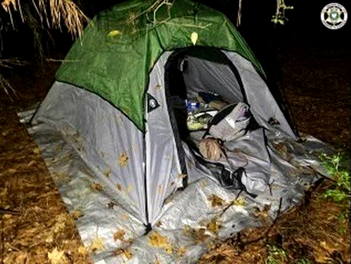 The tent that Materne set up in the woods for the young girl who he ditched after finding out her age.