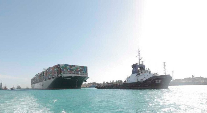 The Ever Given accompanied by tugboats in the Suez Canal after it was freed.
