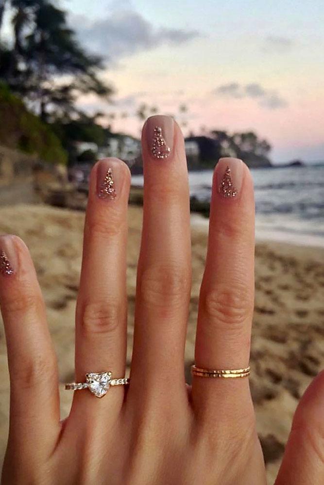 marriage proposal best engagement photo hand with ring sand background