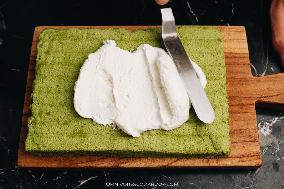 Decorating matcha cake with whipped cream