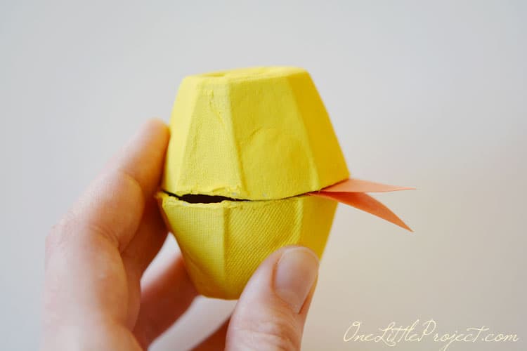 These fun little candy filled Easter egg carton chicks are a super cute Easter craft idea for kids.