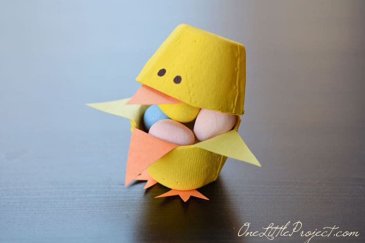 These fun little candy filled Easter egg carton chicks are a super cute Easter craft idea for kids.