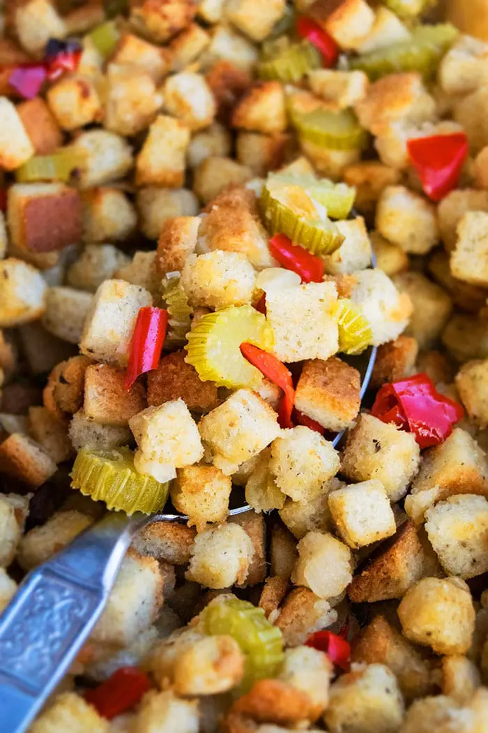 Easy One Pot Turkey Stuffing or Dressing in Large Spoon- Closeup Shot.