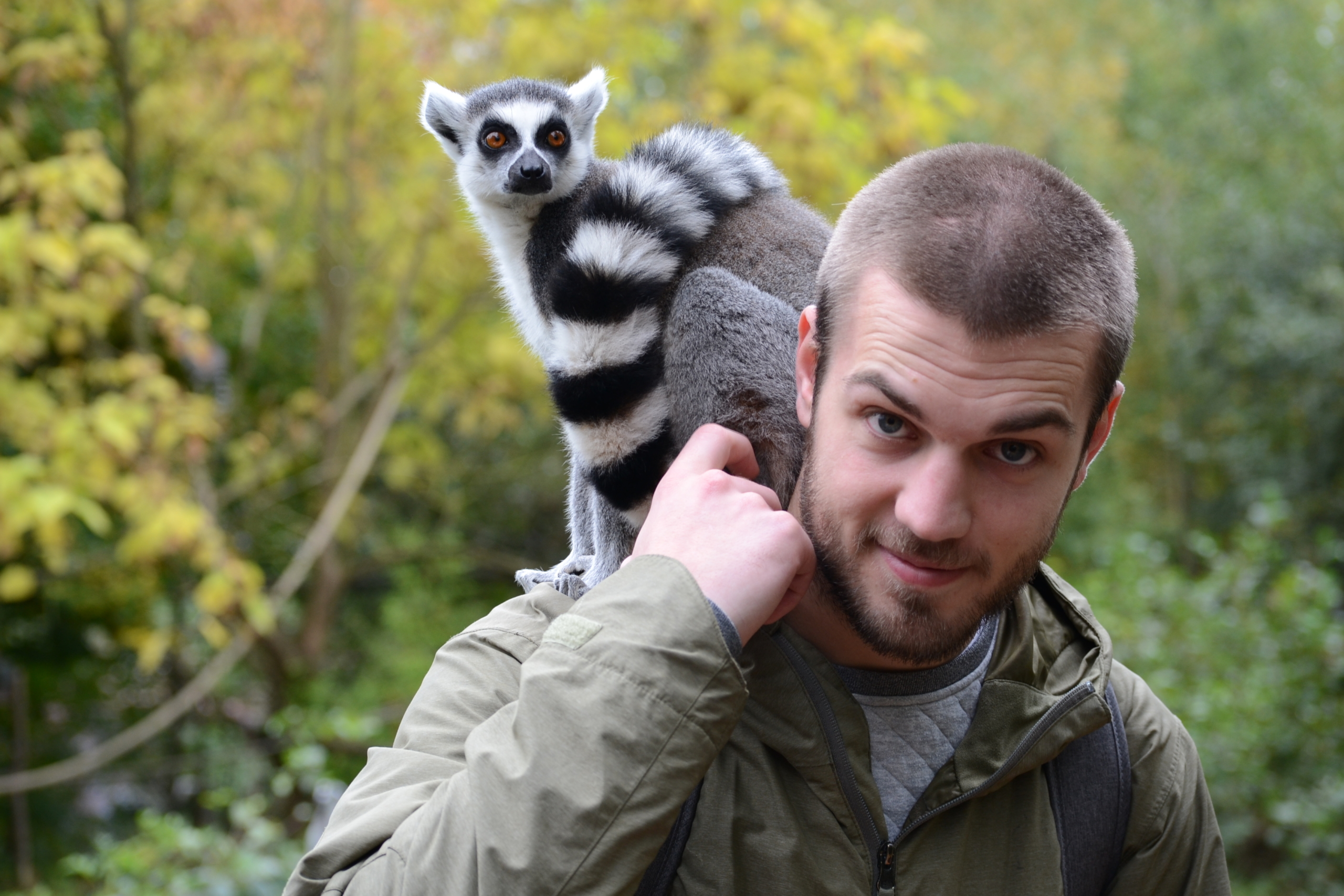 Man with animal smiling at camera