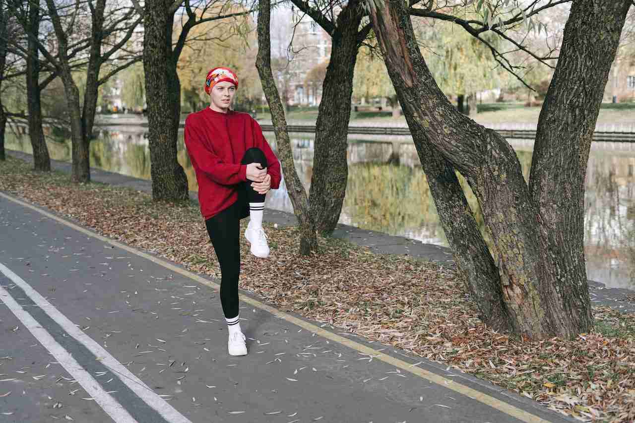 Runner woman engage in dynamic stretching before a run