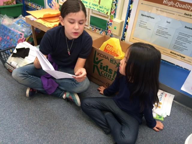 Fourth grade teaching kinder about cycles in the garden