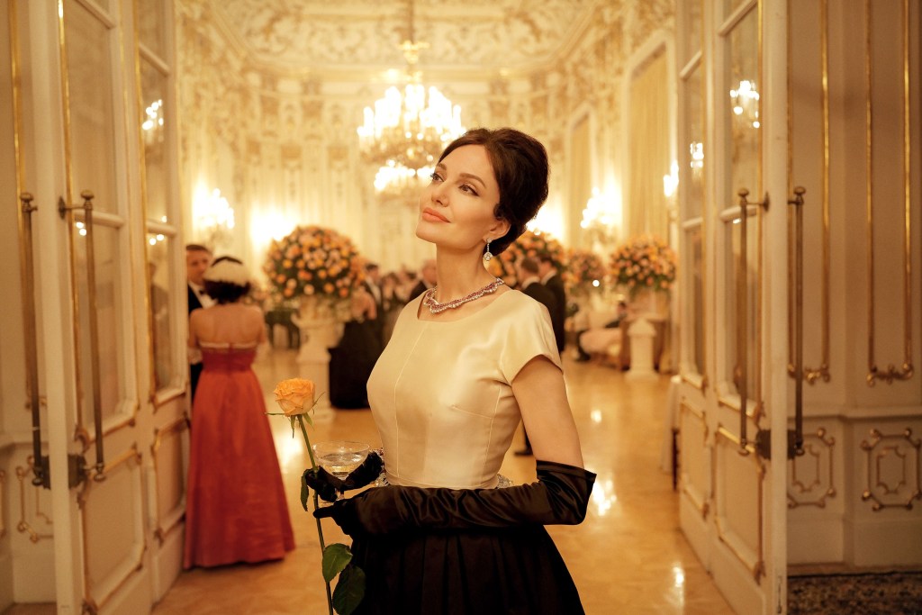 Angelina Jolie pictured in "Maria", wearing a glamorous ball gown. 