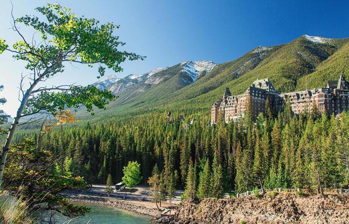 Daytime exterior of grounds and hotel of Fairmont Banff Springs in Alberta, Canada.