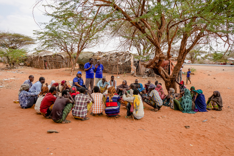 On 16 February 2023, Ibrahim speaks to community members in Tana River County, Kenya, about the ongoing oral cholera vaccination campaign. The Ministry of Health of Kenya, working with WHO, UNICEF and other partners, vaccinated approximately 2 million people against cholera in a campaign that ran from 11 to 21 February 2023.