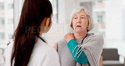 Healthcare, shoulder pain and a woman with her doctor in the hospital, talking during a consultation. Medical, insurance or anatomy and senior female patient in a clinic with a medicine professional