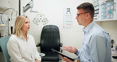 Hospital, doctor and woman in consultation, eye test and explaining to patient, optometry and diagnosis. Office, person and exam for eyecare in clinic, talking and appointment of healthcare or vision