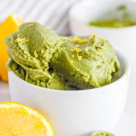 easy homemade vegan matcha ice cream recipe in a white bowl with lemon zest (non dairy ice cream)