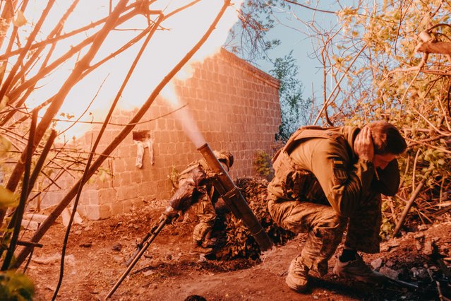 A Ukrainian mortar crew in the last decade of April 2024 fires a 120mm round at the Russian positions as soldiers defend the city situated halfway between Bakhmut and Kostyantynivka, which has become the primary target of Russian attacks. (Photo by Anadolu/Getty Images)