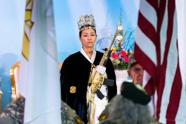 Rev. Yeon Ah Lee Moon of the Sanctuary Church holds a gold AR-15 during a ceremony to rededicate marriages at the World Peace and Unification Sanctuary in Newfoundland, Pennsylvania, USA, 28 February 2018. (Photo by Jim Lo Scalzo/EPA/EFE)