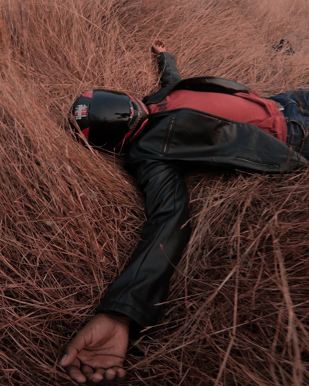 Motorcycle Rider Lying on Ground