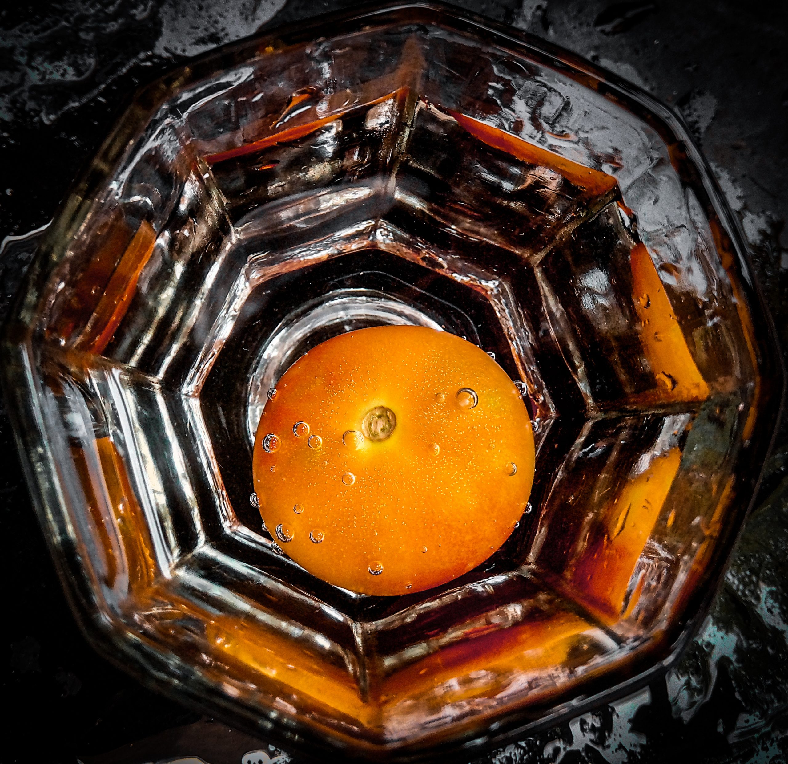 Tomato in the Glass of Water on Focus