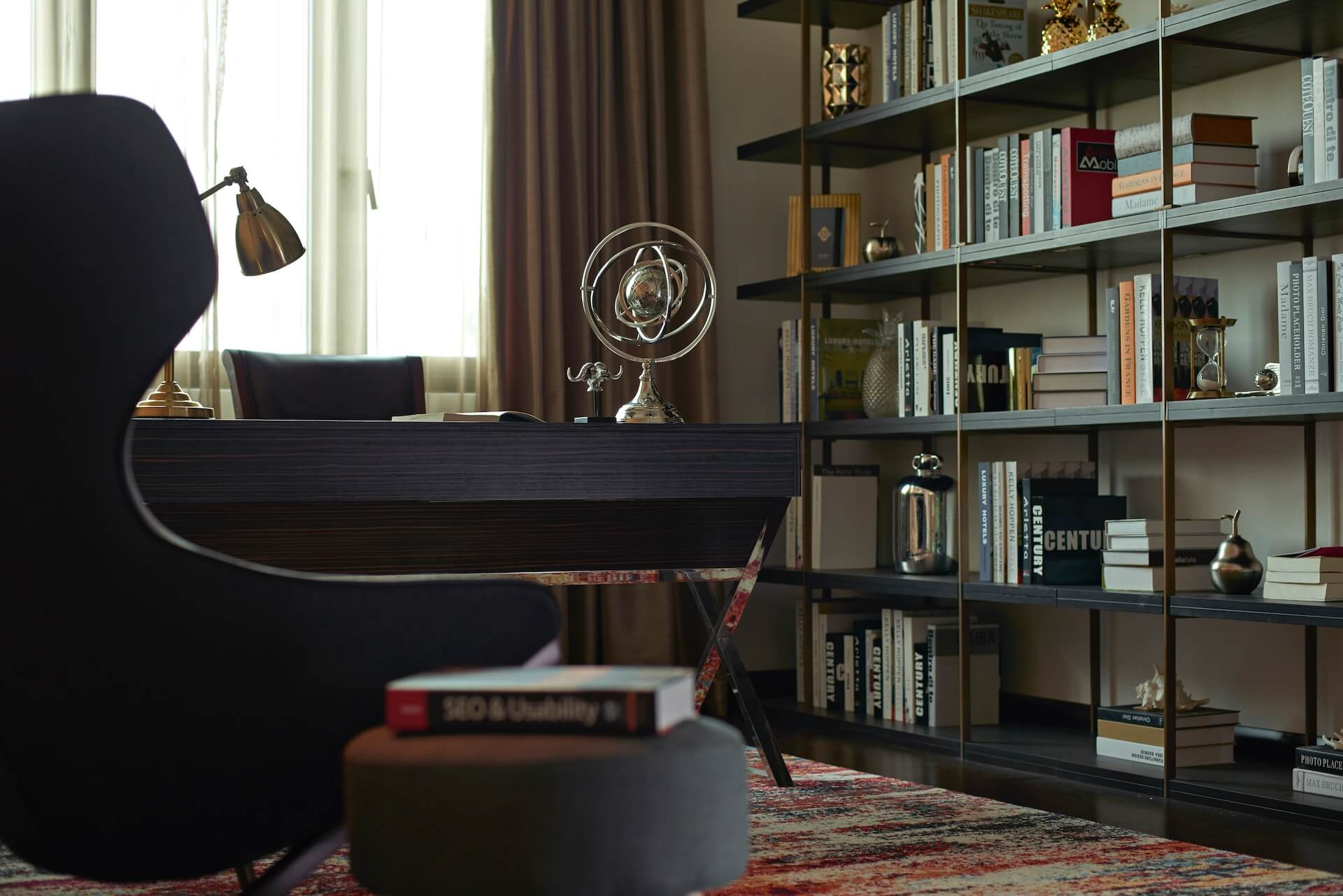 Elegant office with book shelves and an arm chair