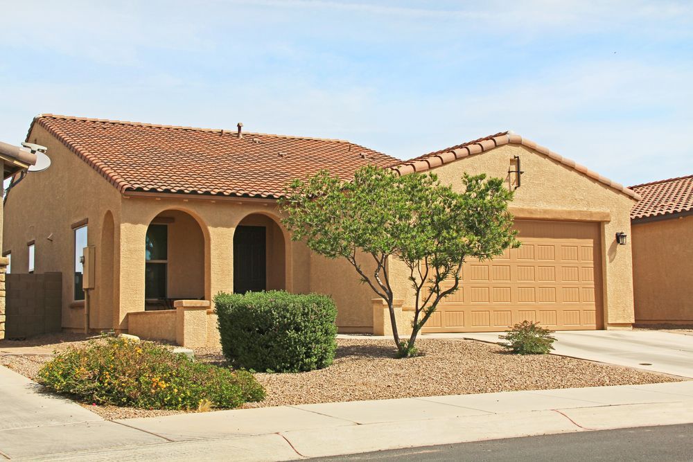 Gold and mustard yellow stucco home