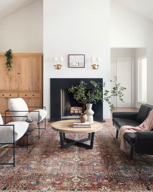 Large red traditional rug in a living room