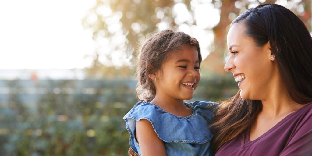 Photo of smiling parent and child