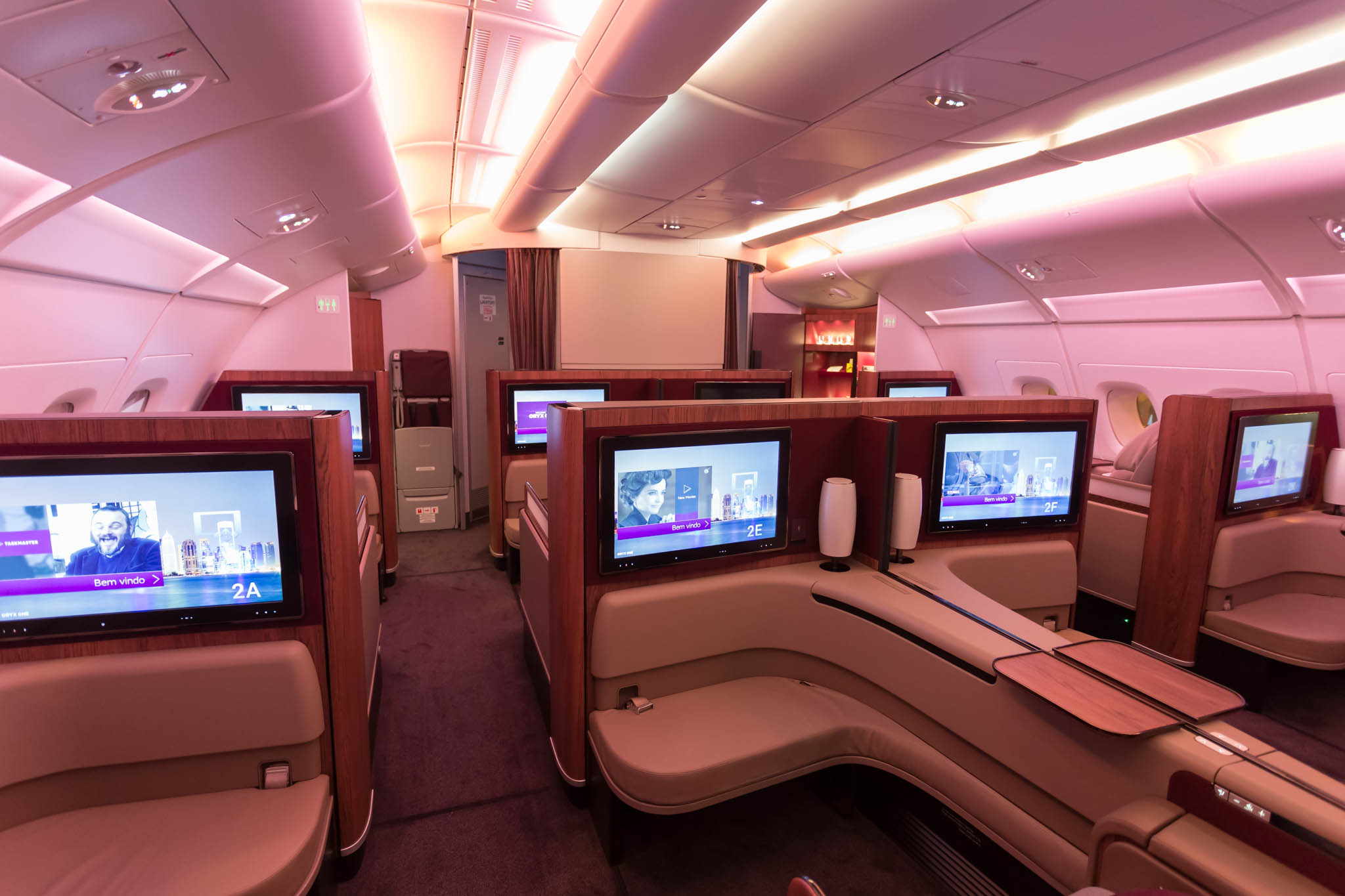 a row of televisions in an airplane