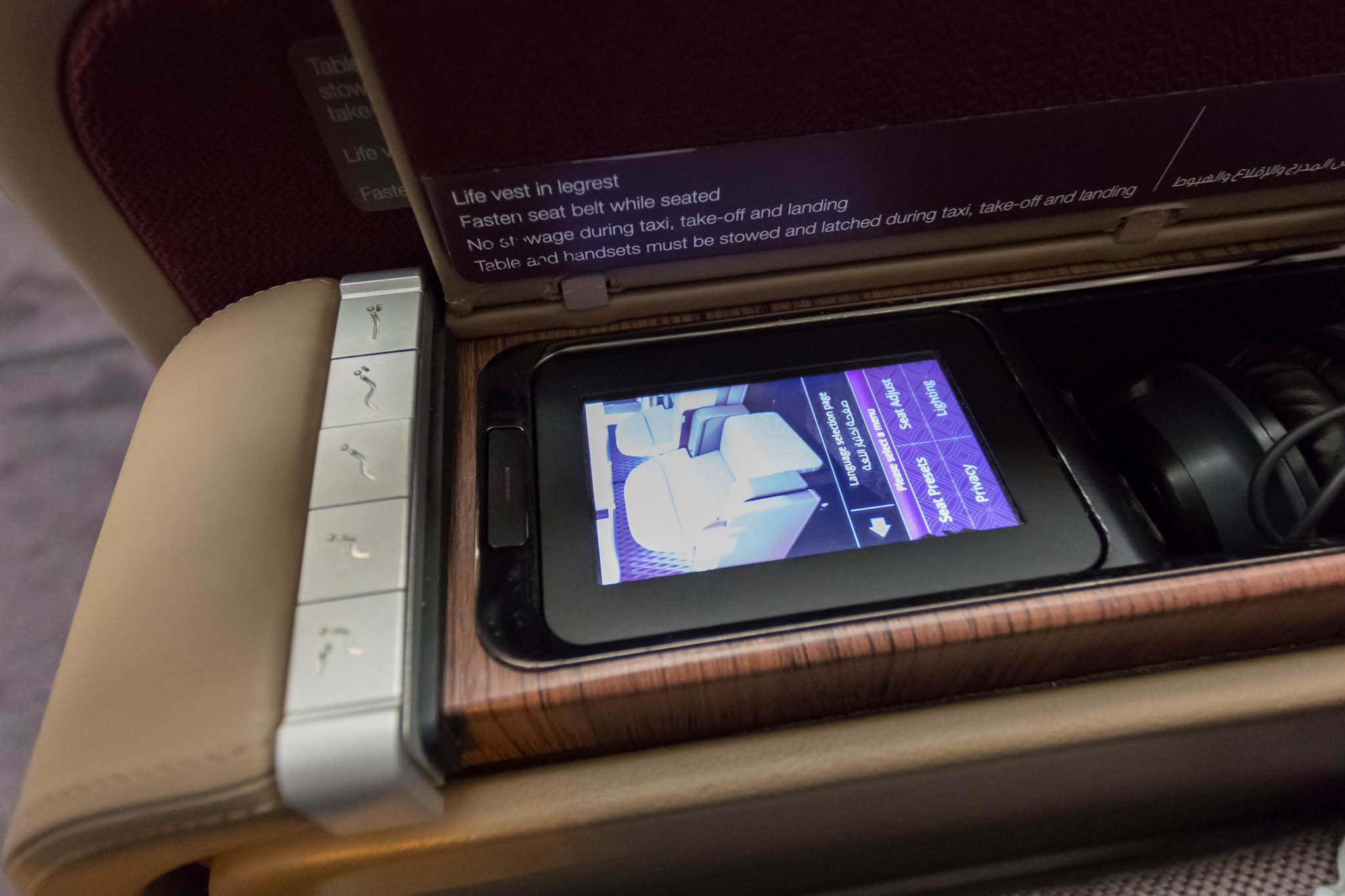 a device on the armrest of a plane