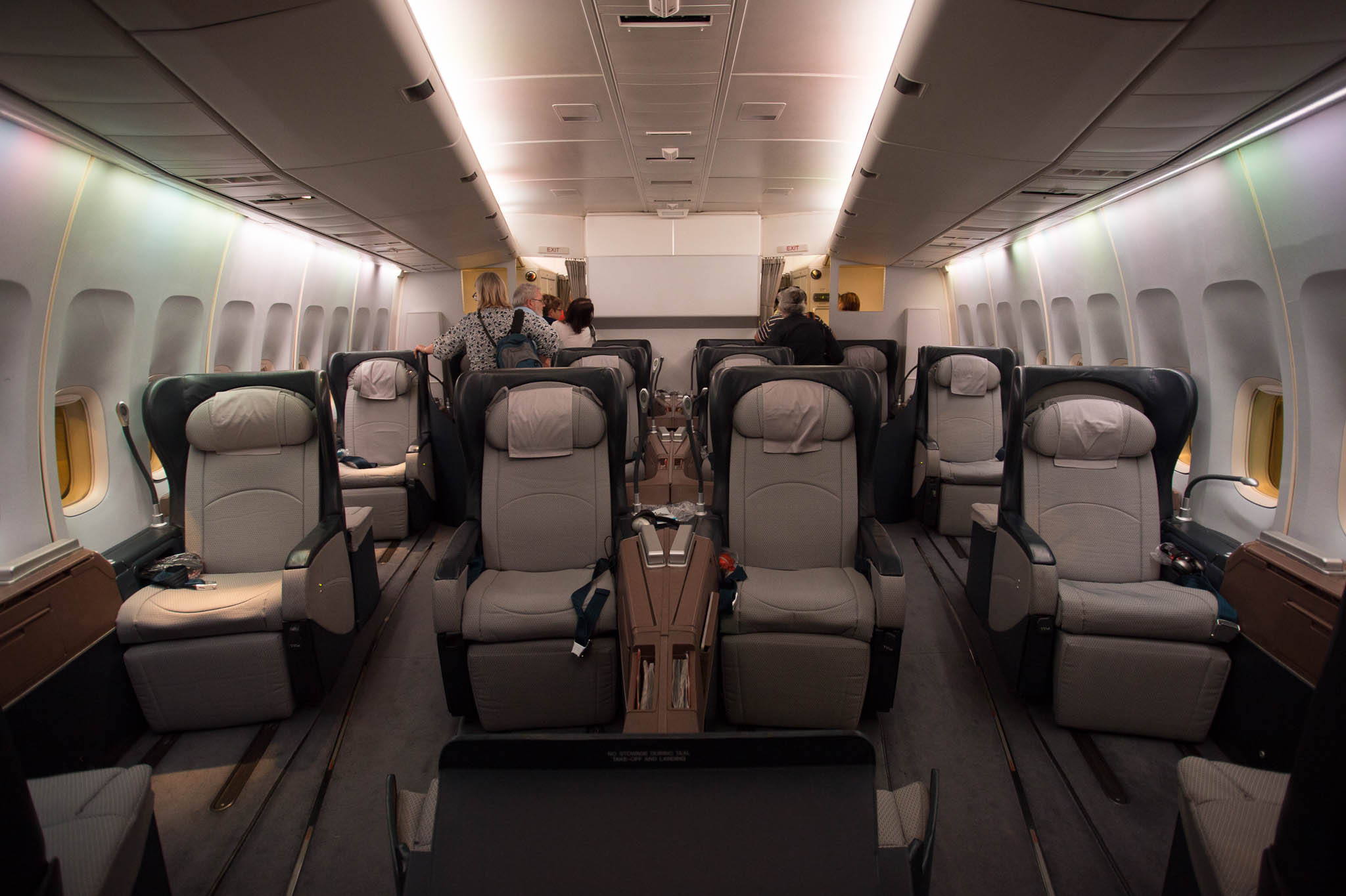 a group of people sitting in an airplane