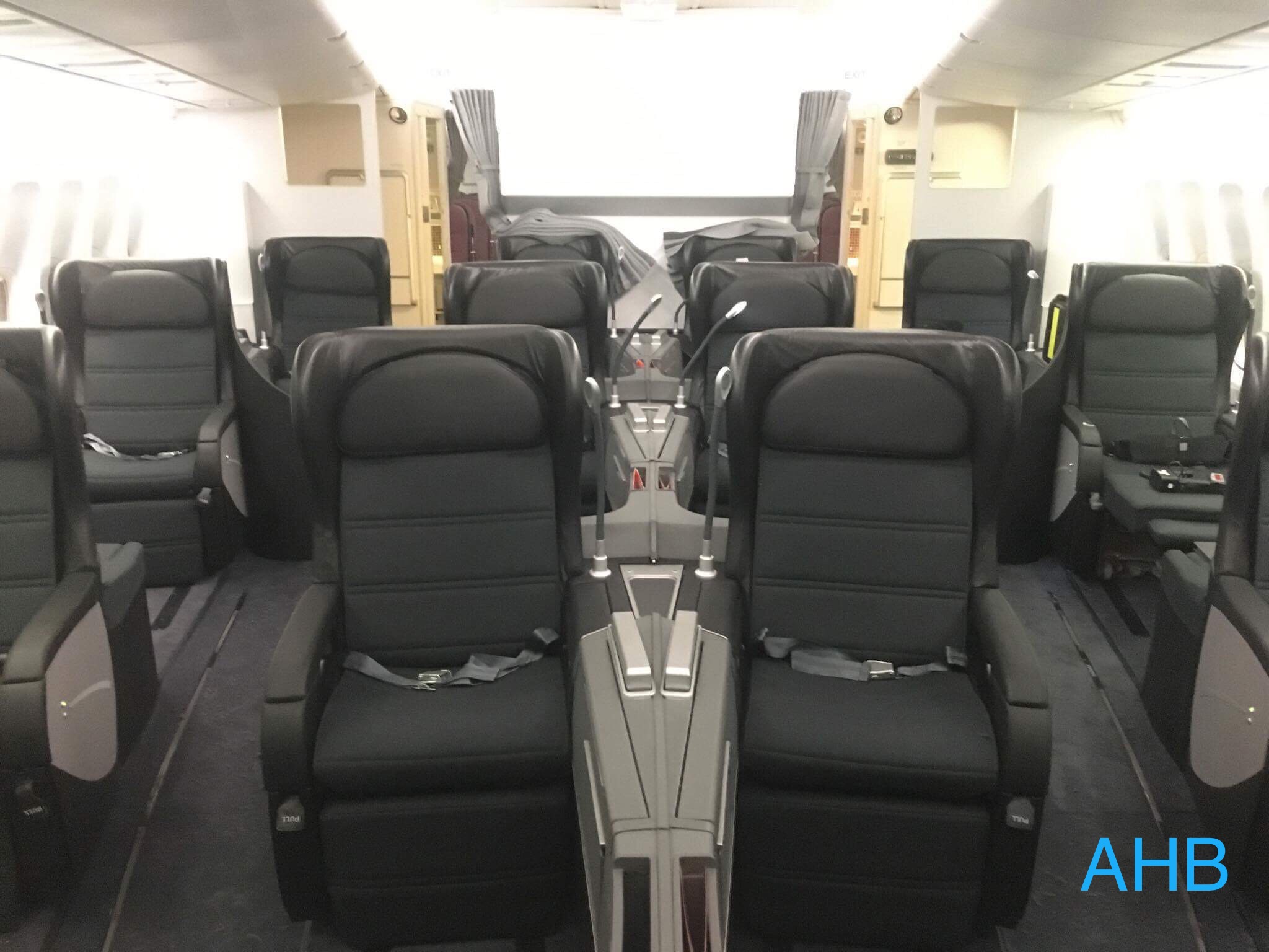 a row of black seats in an airplane