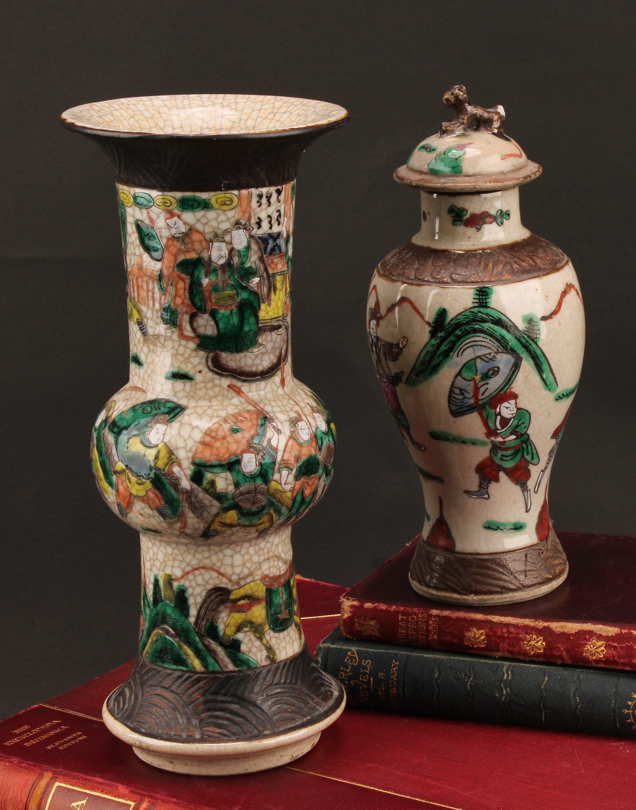 A Chinese gu vase, painted in polychrome enamels with warriors on a crackle-glazed ground, 25.5cm