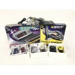 A box containing 6 Scalextric cars. As well as a D