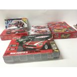 A collection of 7 model car kits by Airfix ..Hornb