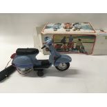 A boxed Piaggio Vespa scooter battery operated. Bo