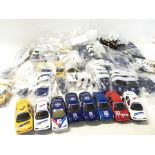 A collection of Scalextric cars and accessories. N