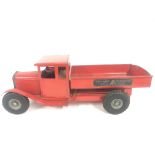 A 1950s Tri-Ang Transport Tipper Truck in Red.