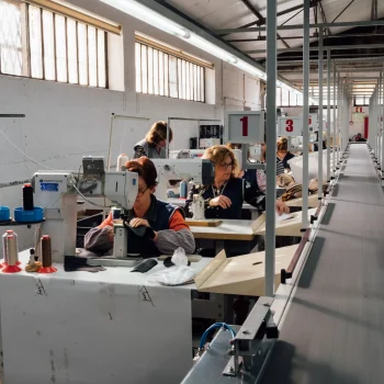 Factory workers at the shoe production line.