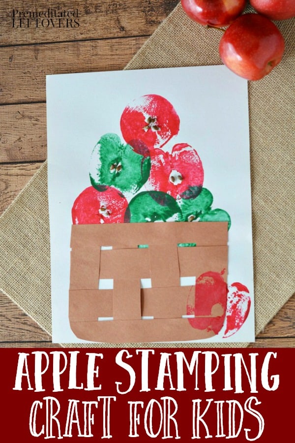 Red and Green apples stamped on white paper using a cut apple as the stamp. Brown paper weave basket is placed on the paper below the apples.