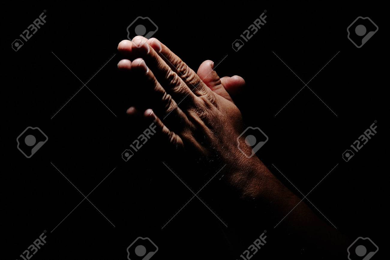 Praying Hands In Black Background Stock Photo, Picture And Royalty Free  Image. Image 48474230.