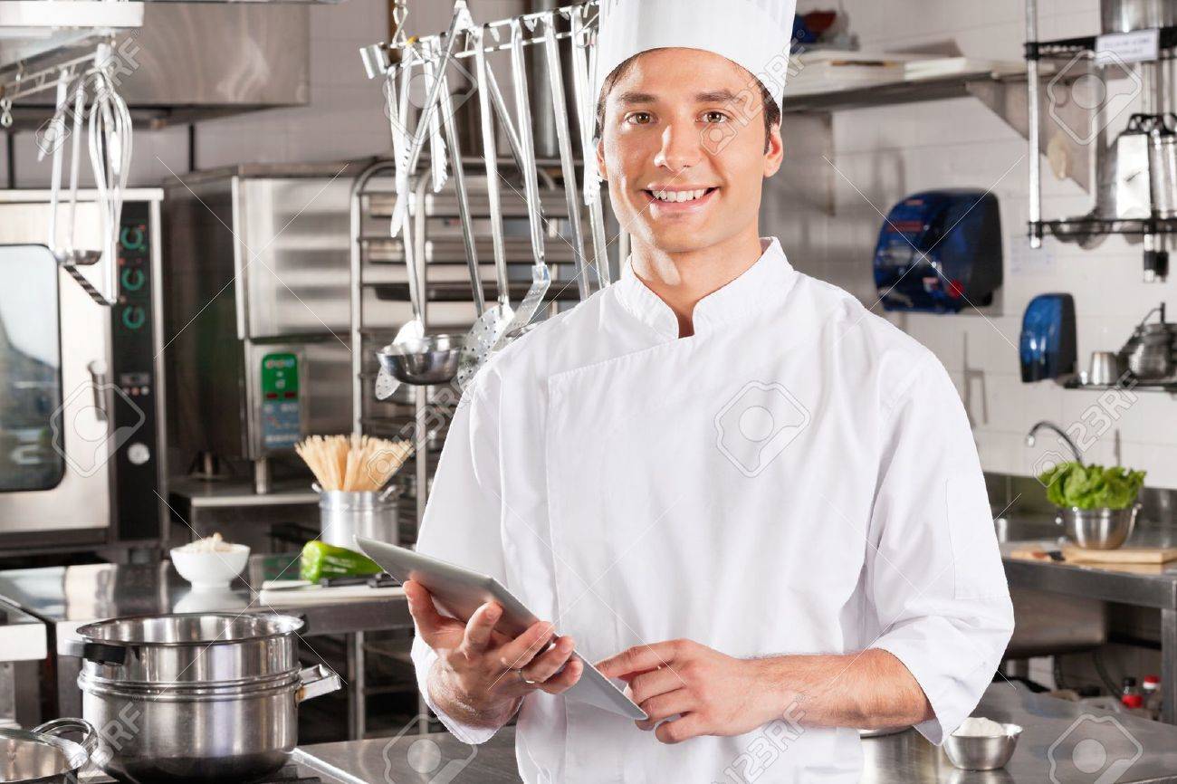 Happy Chef Holding Tablet Computer Stock Photo, Picture And Royalty Free  Image. Image 18005913.