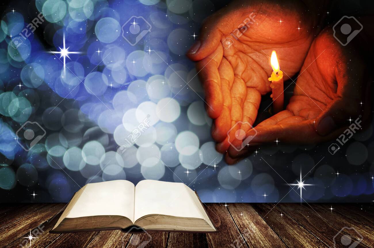 Christmas Background, Prayer Hand With Candle And Open Blank Book On Wooden  Deck Stock Photo, Picture And Royalty Free Image. Image 137423399.