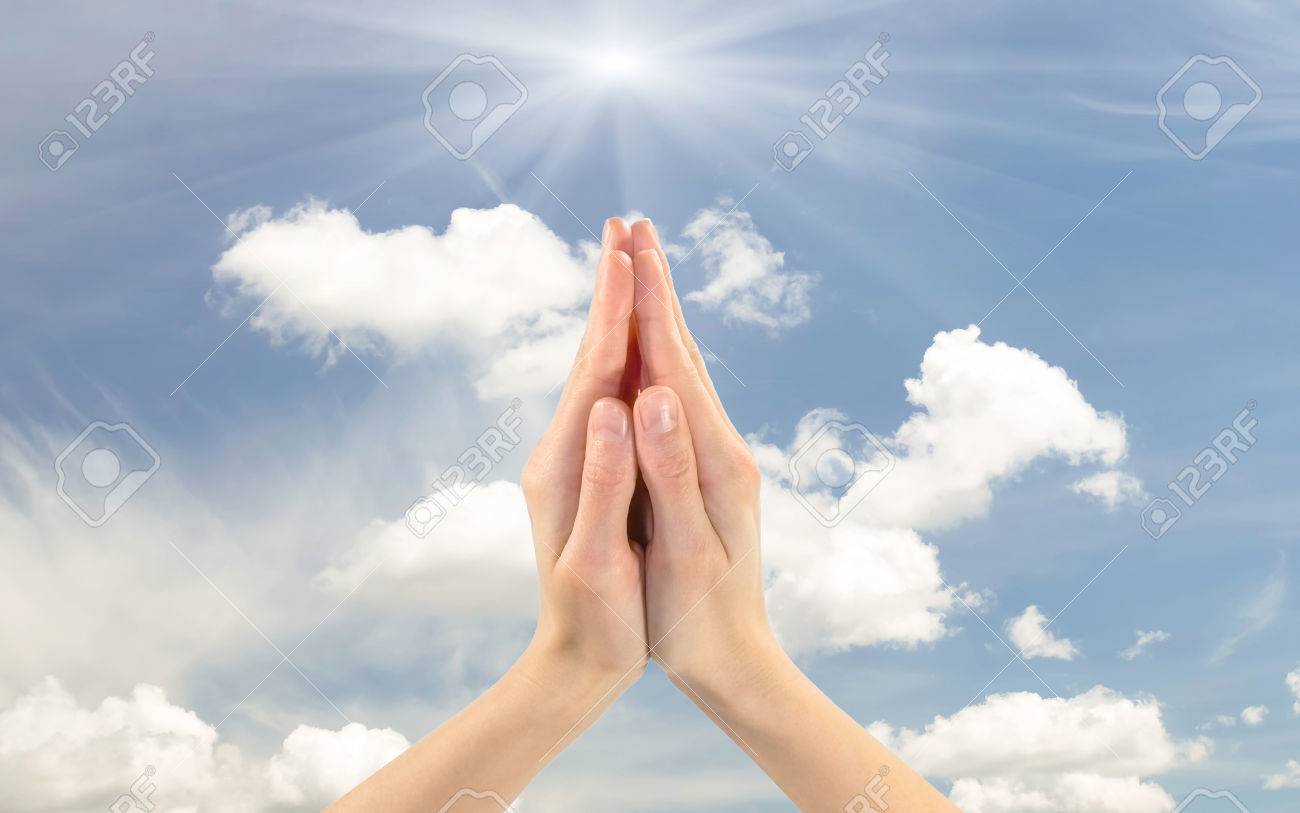 Concept Of Prayer And Religion. Praying Hands Of Man On A Background Cloudy  Sky Stock Photo, Picture And Royalty Free Image. Image 57758319.