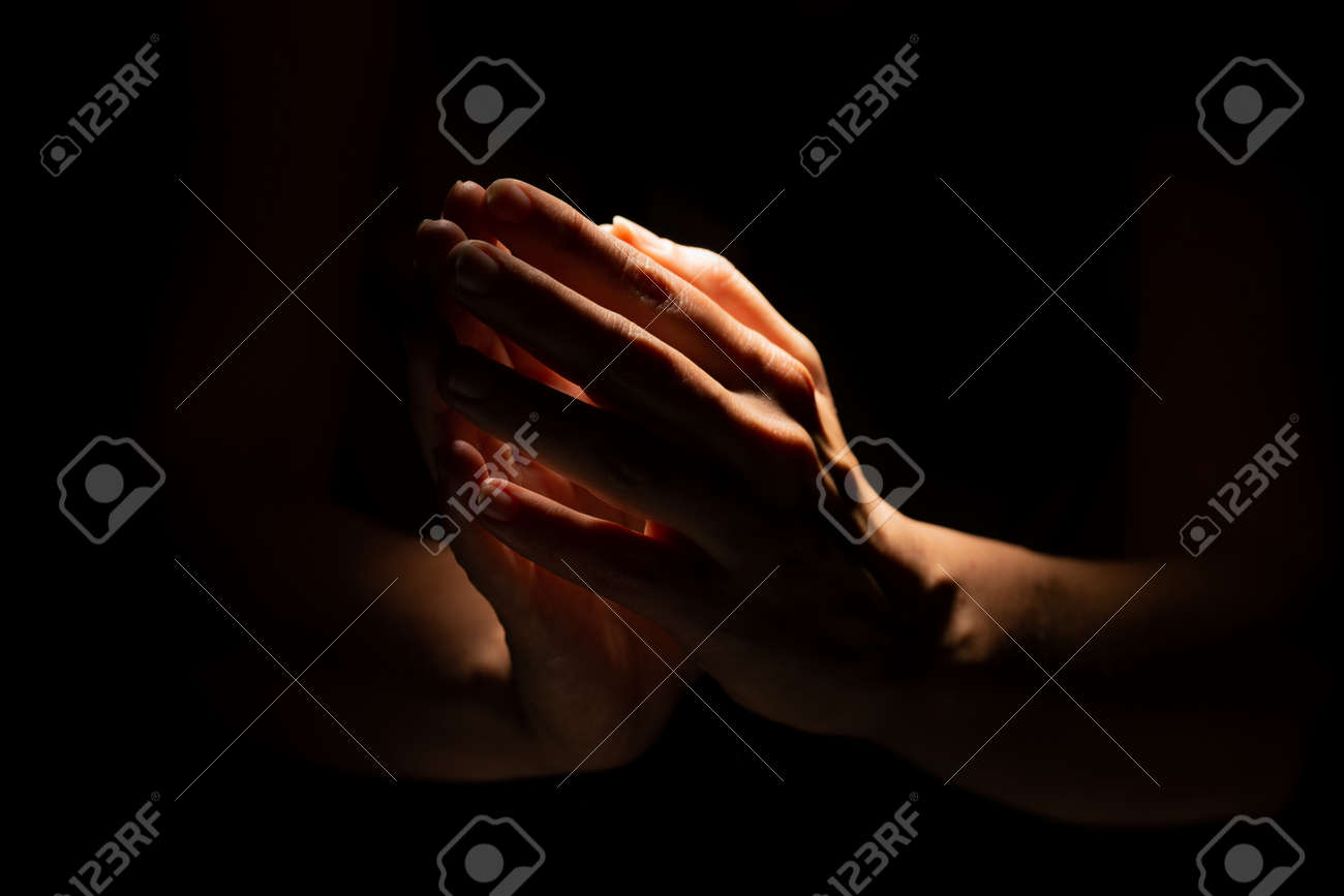 Praying Hands On A Black Background. Light From Above. Hands Folded In  Prayer. Hand Gestures Stock Photo, Picture And Royalty Free Image. Image  164219131.