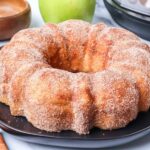 Apple Cider Doughnut Cake on a black plate